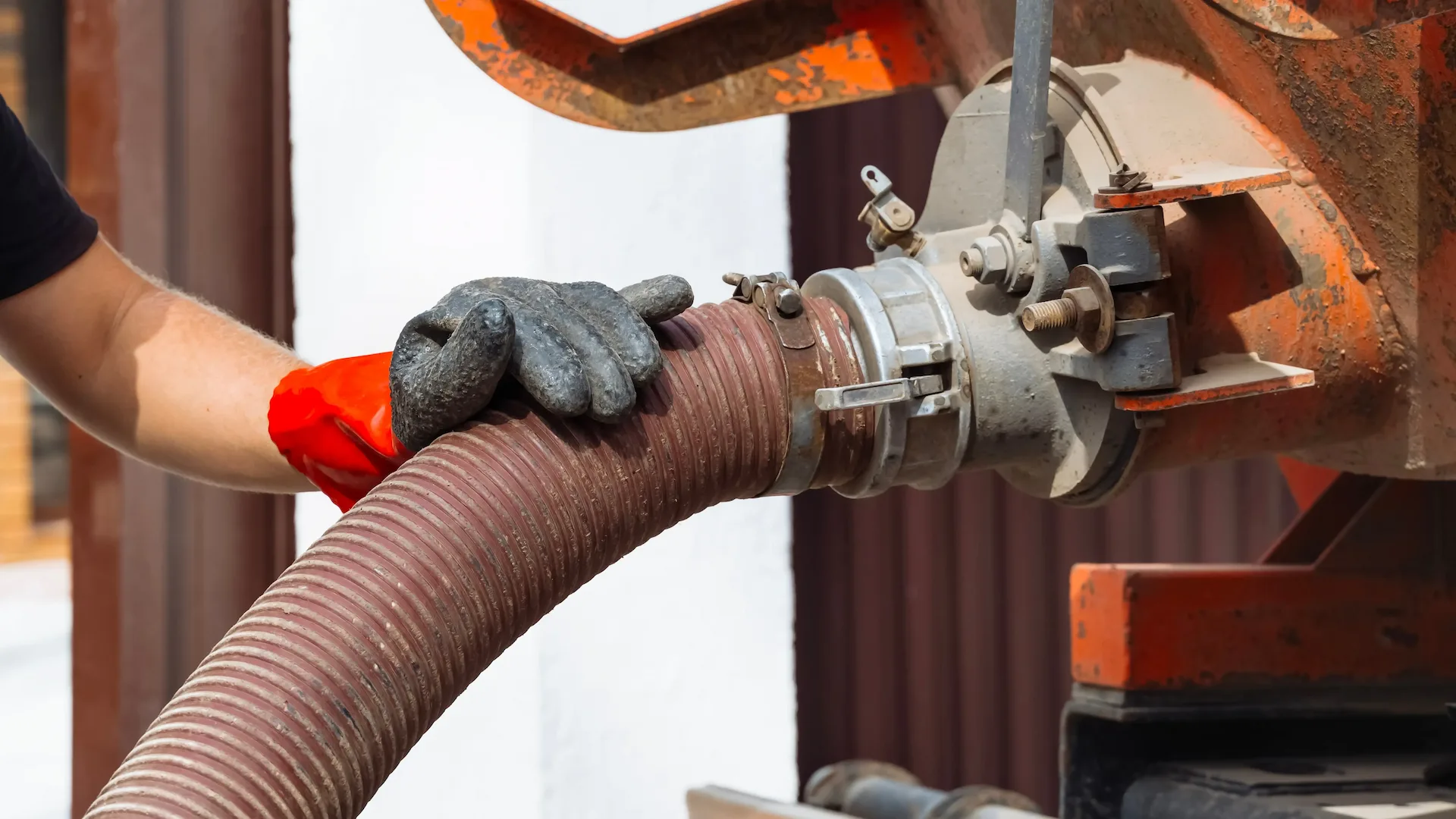 Septic technician servicing a residential tank in Filer